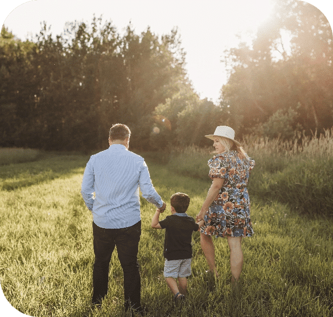 Geen Family Walking in a Field